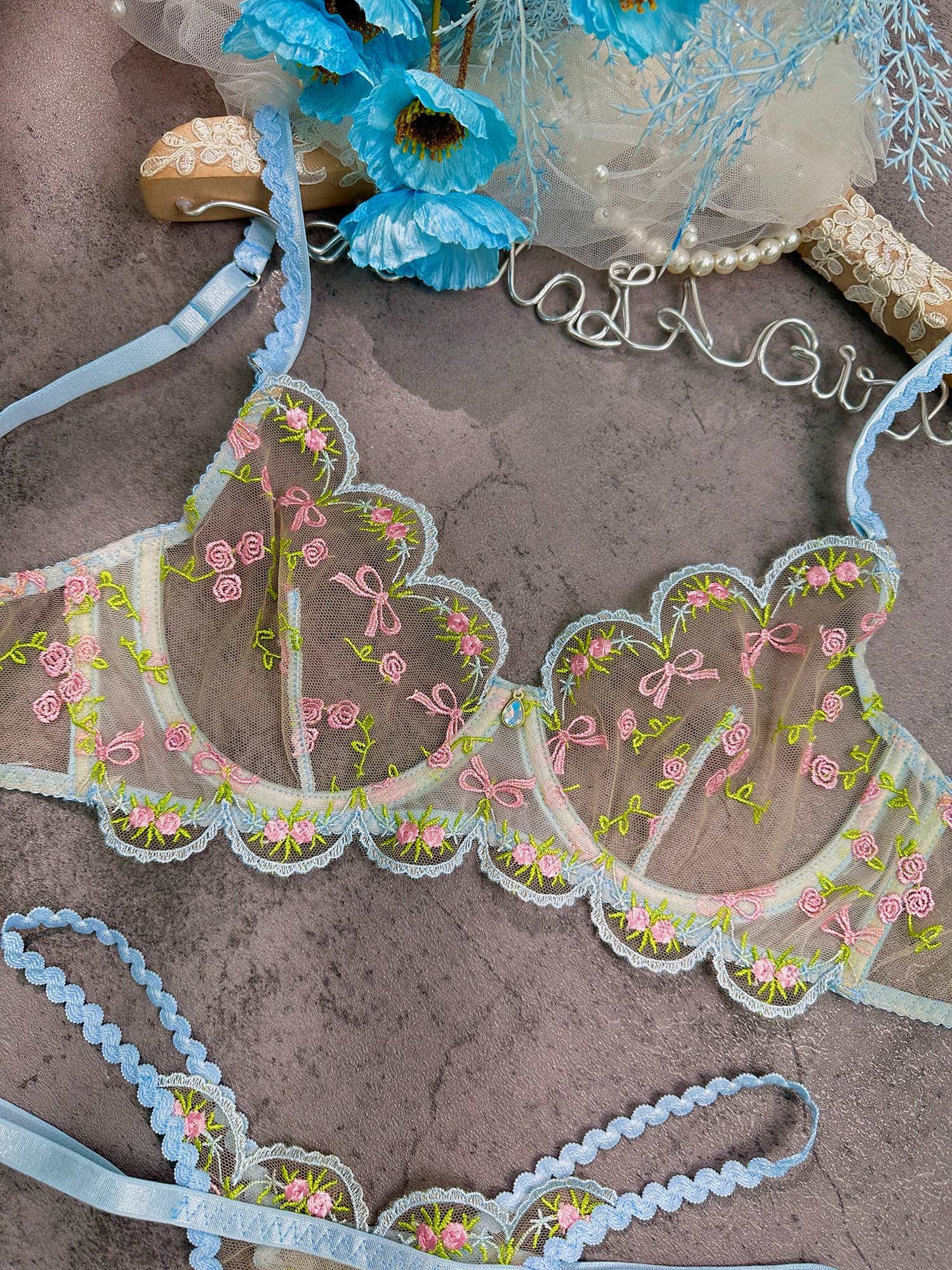 Stylish arrangement of the Elegant 2-Piece Light Blue Lace Lingerie Set, highlighting the intricate details and elegance of light blue lace lingerie.