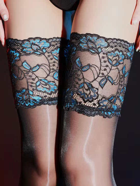 Elegant Sheer Lace Stockings elegantly draped, showcasing the luxurious fabric and intricate design that redefine sophistication.