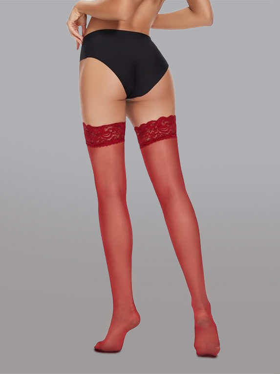 Elegant 15 Denier Thigh-High Lace Stockings showcased against a chic setting, emphasizing their sophisticated floral detail.