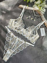 Luxurious bridal lingerie set: Heavenly Glow Radiance displayed with a focus on its classic white satin and chic golden embellishments.