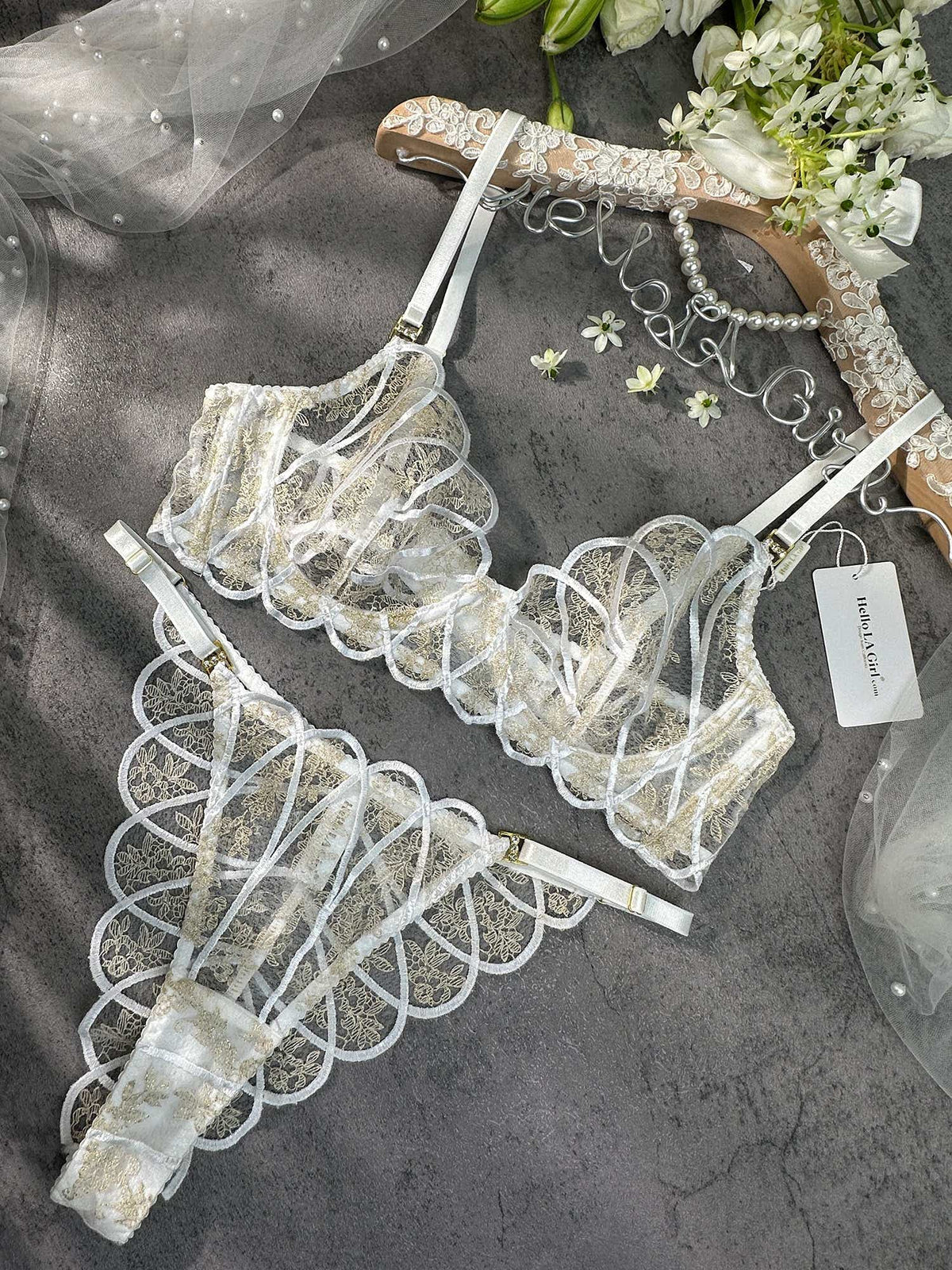 Luxurious bridal lingerie set: Heavenly Glow Radiance displayed with a focus on its classic white satin and chic golden embellishments.