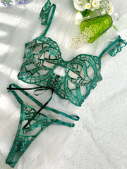 Luxe Green Metallic Lingerie Set arranged artistically to showcase the exquisite craftsmanship of the shimmering fabric and elegant design, a must-have in any upscale metallic lingerie set collection.