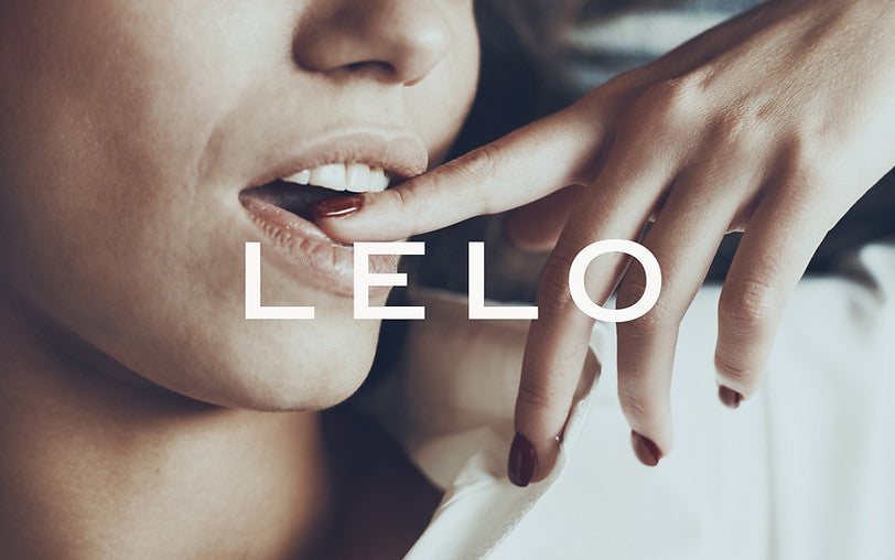 Close-up on a woman with a tactile gesture alongside LELO branding - embodying the luxurious experience of the lipstick vibrator.
